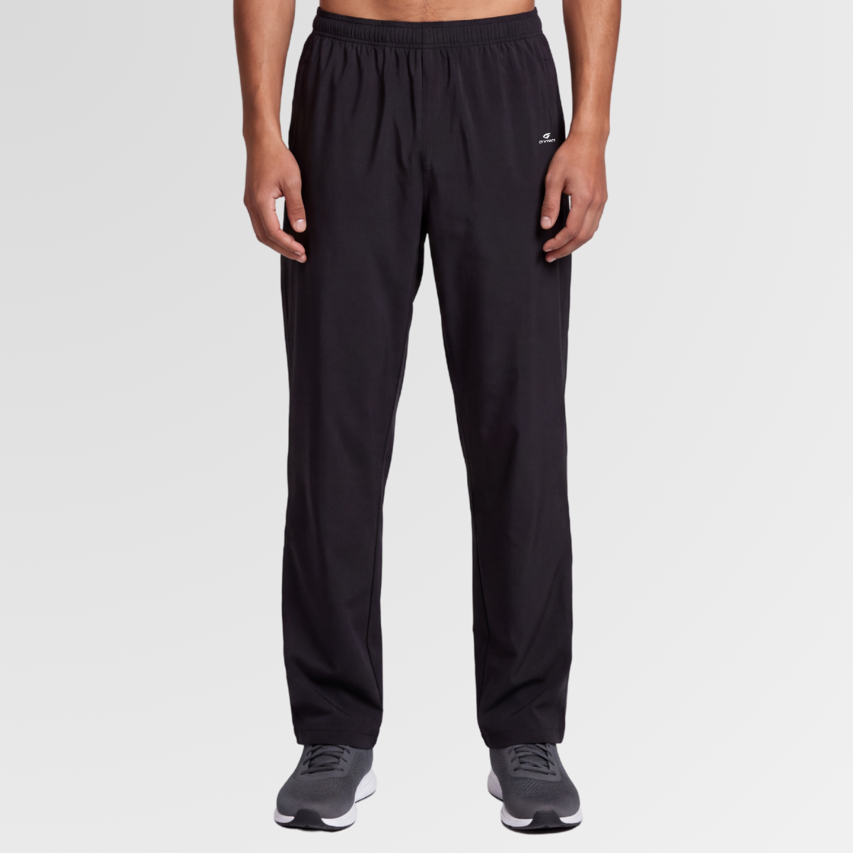 Man wearing GYRO Wander Trousers in black, front view
